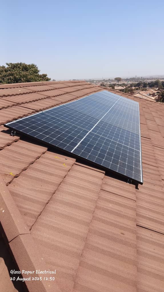 Residential solar installation on tile roof